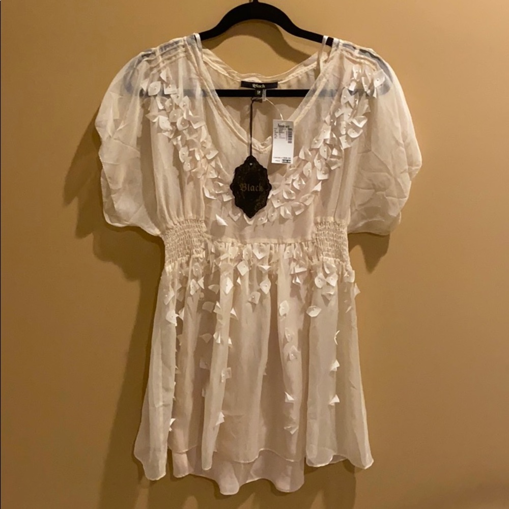 Tunic with floral appliqué